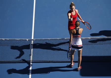 Tennis - Australian Open - Quarterfinals - Rod Laver Arena, Melbourne, Australia, January 24, 2018. Simona Halep of Romania shakes hands with Karolina Pliskova of Czech Republic after Halep won their match. REUTERS/Toru Hanai