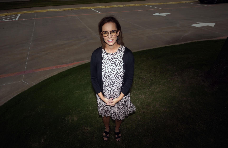 Shawna Jensen stands for a portrait in Mansfield, Texas, on Thursday, Sept. 24, 2020. Jensen’s moment of reckoning came in March, as she sat in her suburban Fort Worth living room next to her fireplace. Her laptop was open to a Zoom happy hour with five girlfriends. She sucked in a breath, gripping her glass of red wine. “Hey guys, I gotta tell you something,” she said. The women, all white, Republican, suburban moms, stared back at her. “I’m not voting for Trump this year. My heart will not let me do it. I can’t vote for someone who is that ugly to other people.” (AP Photo/LM Otero)