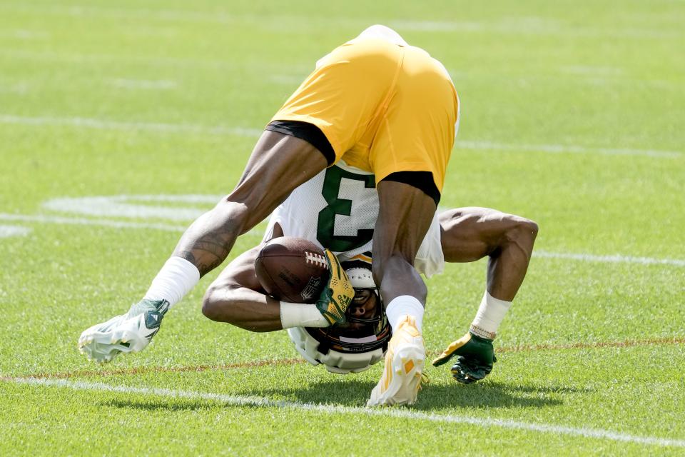 Green Bay Packers' Aaron Jones catches a pass during NFL football training camp Thursday, July 27, 2023, in Green Bay, Wis. (AP Photo/Morry Gash)
