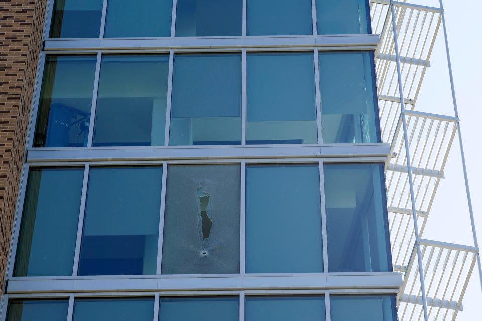 A bullet-shattered window of a dorm room is seen at Thurgood Marshall Hall at Morgan State University on Oct. 4, 2023 in Baltimore, Maryland. Police are still looking two suspects who opened fire on the campus of the historically black college as students were attending a homecoming week event, injuring five people. (Photo by Anna Moneymaker/Getty Images)