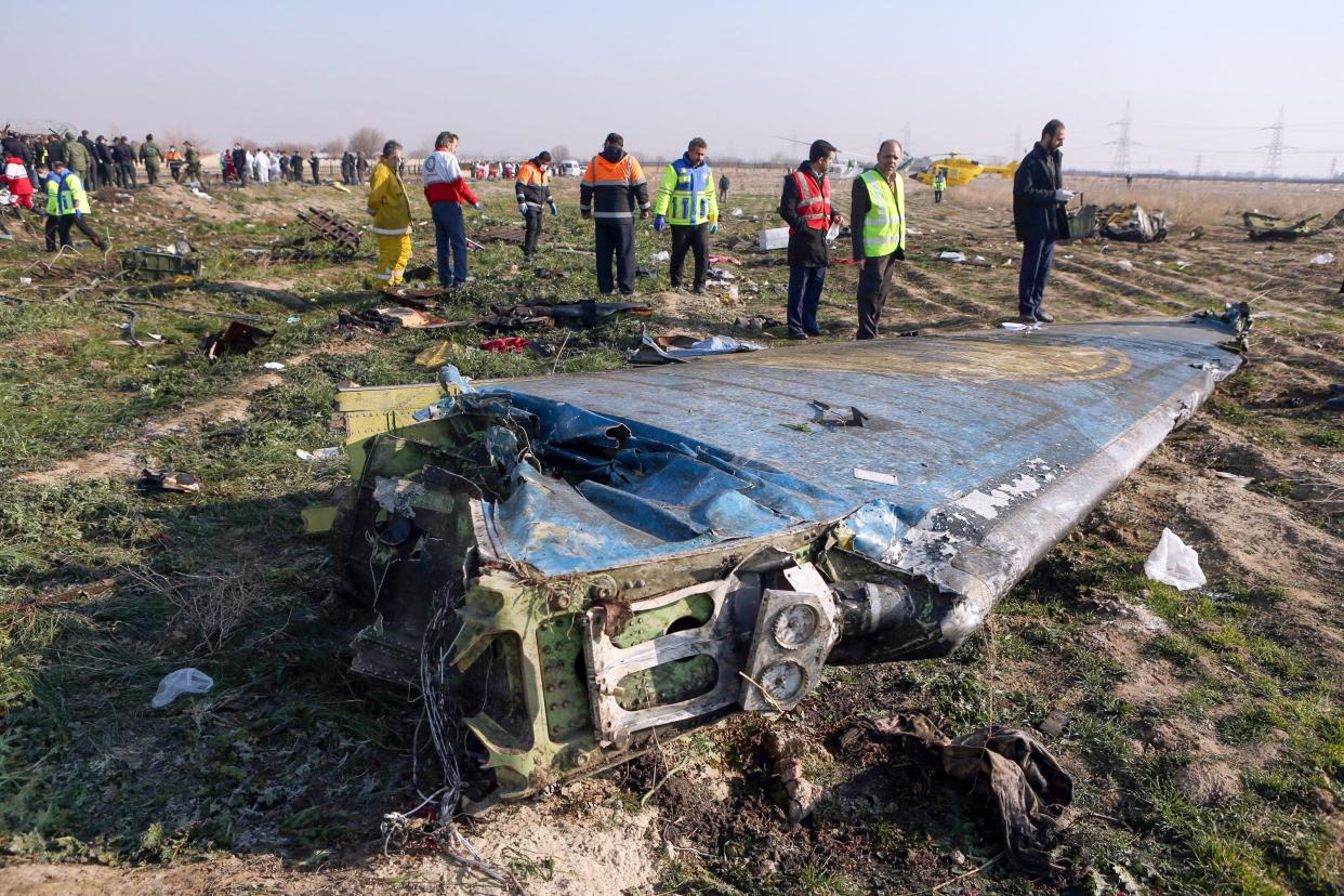 Rescue teams search the crash site of Ukraine International Airlines Flight 752 in Iran.