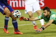 Greece's Orestis Karnezis dives forward to intercept the ball during their 2014 World Cup Group C soccer match against Japan at the Dunas arena in Natal June 19, 2014. REUTERS/Kai Pfaffenbach