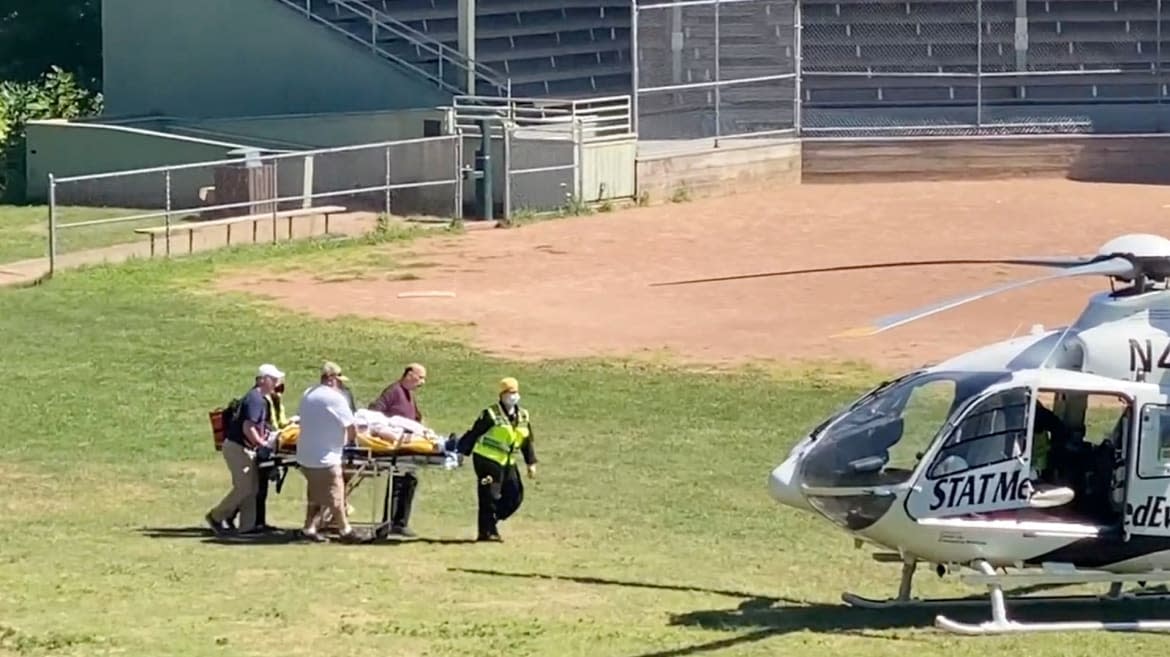 <div class="inline-image__caption"><p>Author Salman Rushdie is transported to a helicopter after he was stabbed on stage.</p></div> <div class="inline-image__credit">TWITTER @HORATIOGATES3</div>