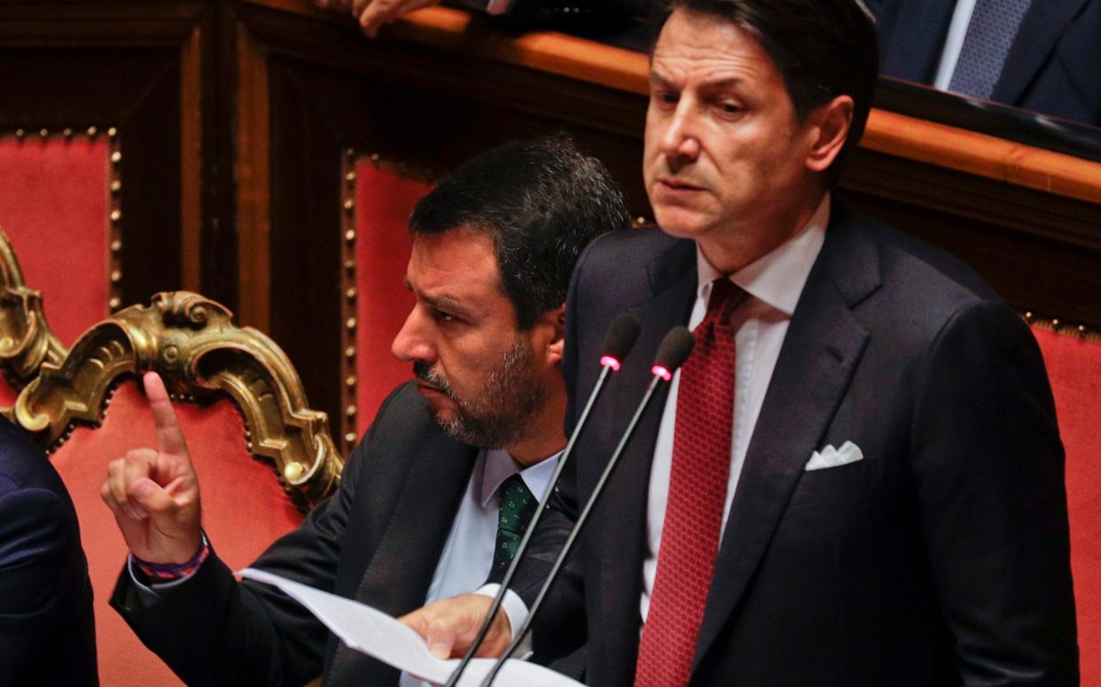 Italian Premier Giuseppe Conte (right) is set to address parliament later today as the possibility of a confidence vote looms.  - AP