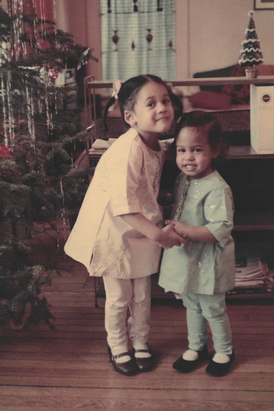 This Dec. 25, 1968 photo provided by the Kamala Harris campaign shows her with her sister, Maya, on Christmas. (Kamala Harris campaign via AP)