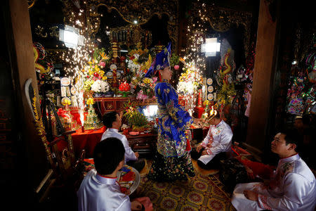 Medium Le Thi Ha performs during a ritual ceremony of Hua Dong at Phu Day temple in Nam Dinh province in Vietnam, March 28, 2017. REUTERS/Kham