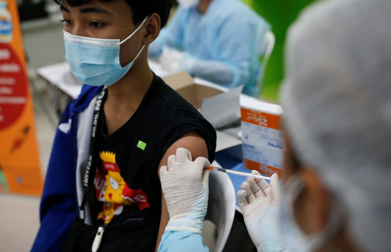 Ahead of schools reopening, high school students get vaccinated in Bangkok