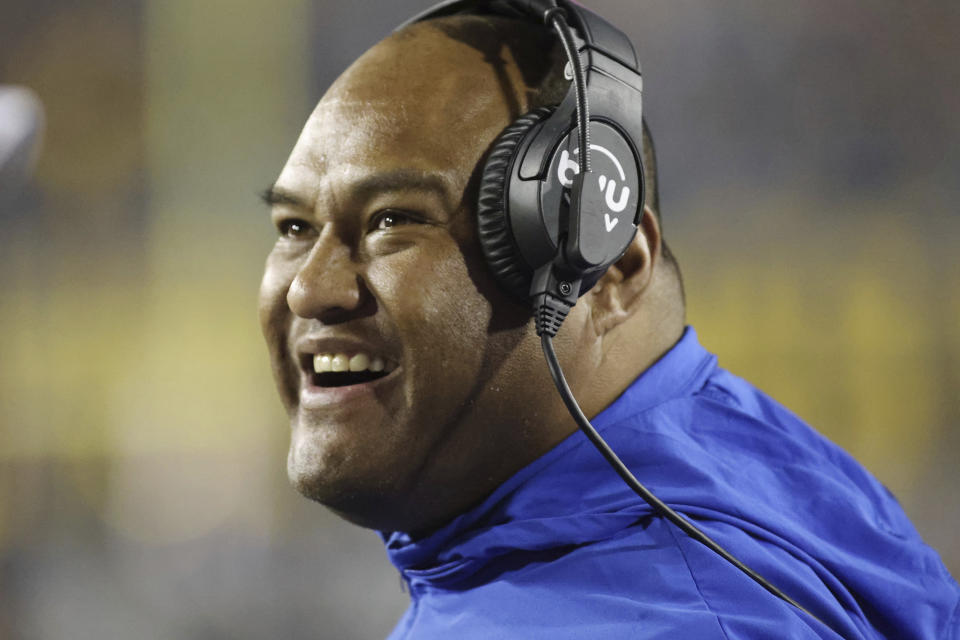 BYU head coach Kalani Sitake looks on during the first half of a college football game against West Virginia on Saturday, Nov. 4, 2023, in Morgantown, W.Va. West Virginia won 37-7. (AP Photo/Chris Jackson)