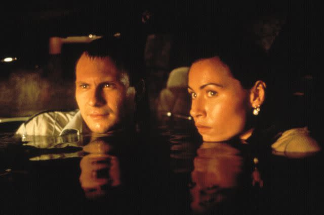 <p>Paramount/Everett</p> (L) Christian Slater and Minnie Driver in 'Hard Rain'