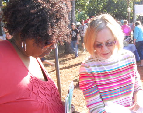 Mom with local artistan Katherine J. Zymbroy going over her most recent work at Kiepersol's Harvest Festival. 