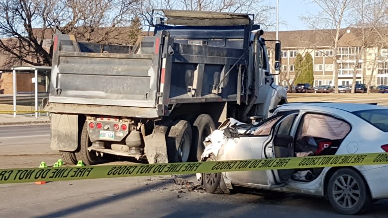 2 people in stable condition after car hits dump truck in Winnipeg