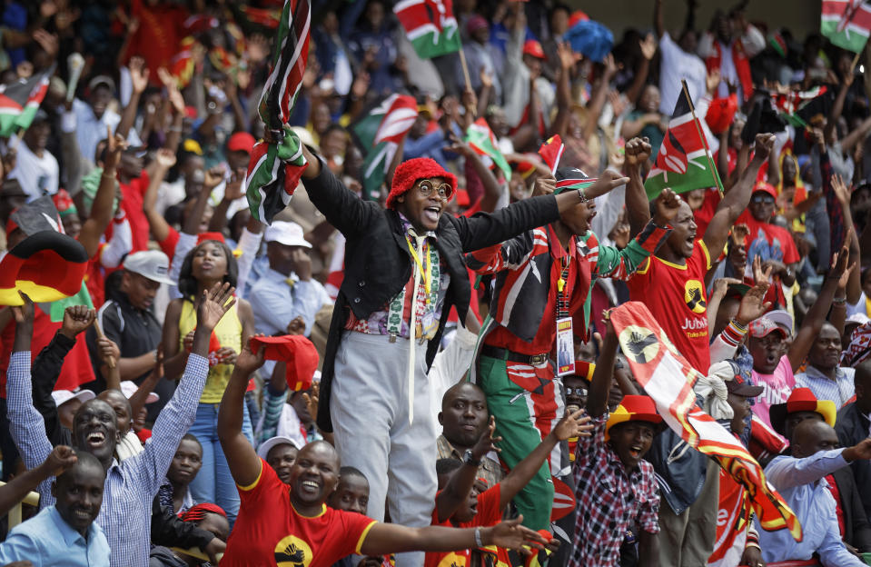 <p>Supporters cheer in the stands as President Uhuru Kenyatta is sworn-in during his presidential inauguration at Kasarani stadium in Nairobi, Kenya Tuesday, Nov. 28, 2017. (Photo: Ben Curtis/AP) </p>