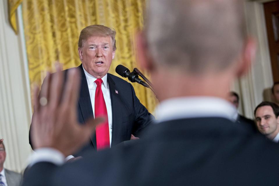 U.S. President Donald Trump speaks as Dennis Muilenburg, chairman and chief executive officer of Boeing Co., right, stands during a National Space Council meeting in the East Room of the White House in Washington, D.C., on Monday, June 18, 2018. (Photo: Andrew Harrer/Bloomberg via Getty Images)