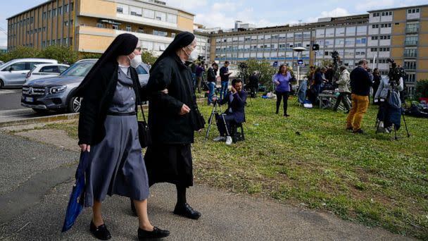 PHOTO: Two nuns walk by the Agostino Gemelli University Hospital in Rome, March 30, 2023, where Pope Francis was admitted on Wednesday after having suffered breathing problems in recent days and was diagnosed with a respiratory infection. (Alessandra Tarantino/AP)