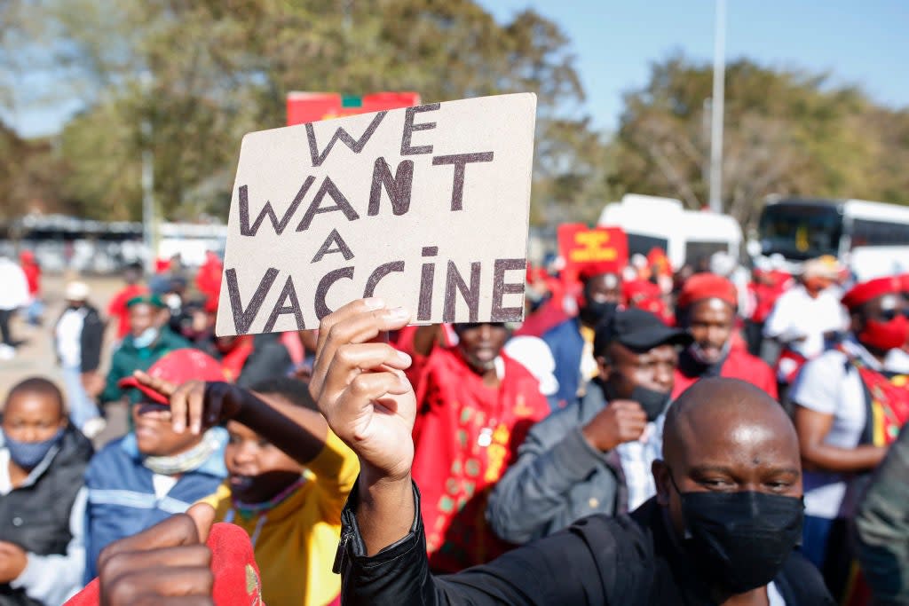 A protest in South Africa last week where fewer than 10 per cent of the population has had one dose of a vaccine according to Our World In Data. The International Monetary Fund has warned that such inequalities could derail global growth. (AFP via Getty Images)