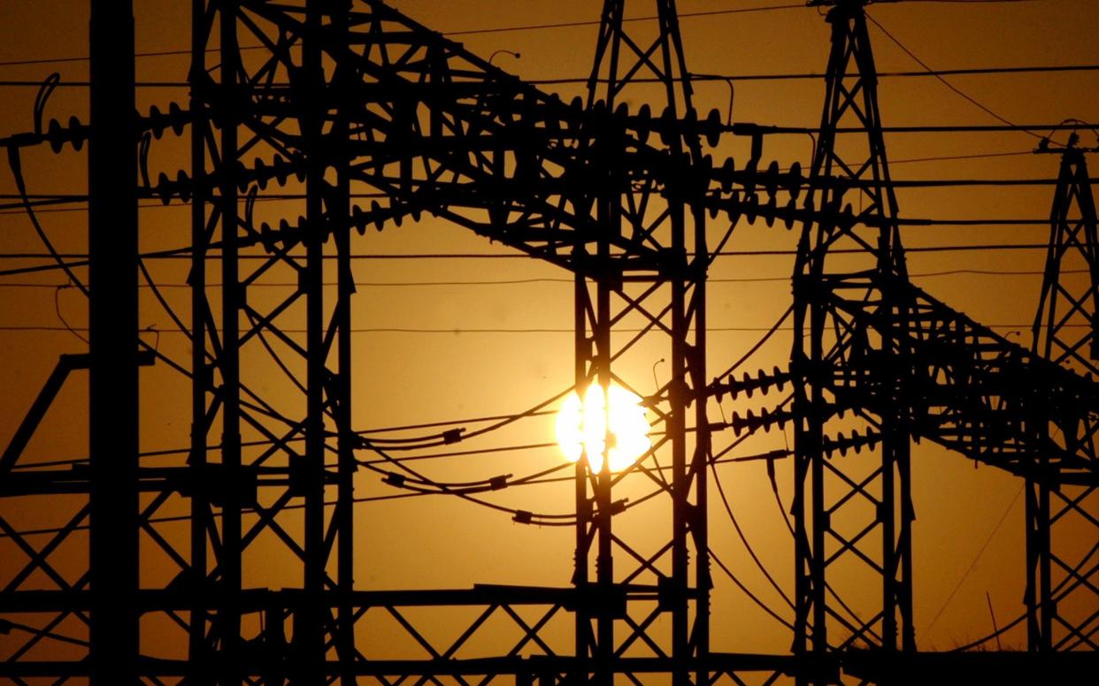 Sun sets behind electric pylons in Allahabad...The sun sets behind electric pylons in the northern Indian city of Allahabad February 22, 2006. 