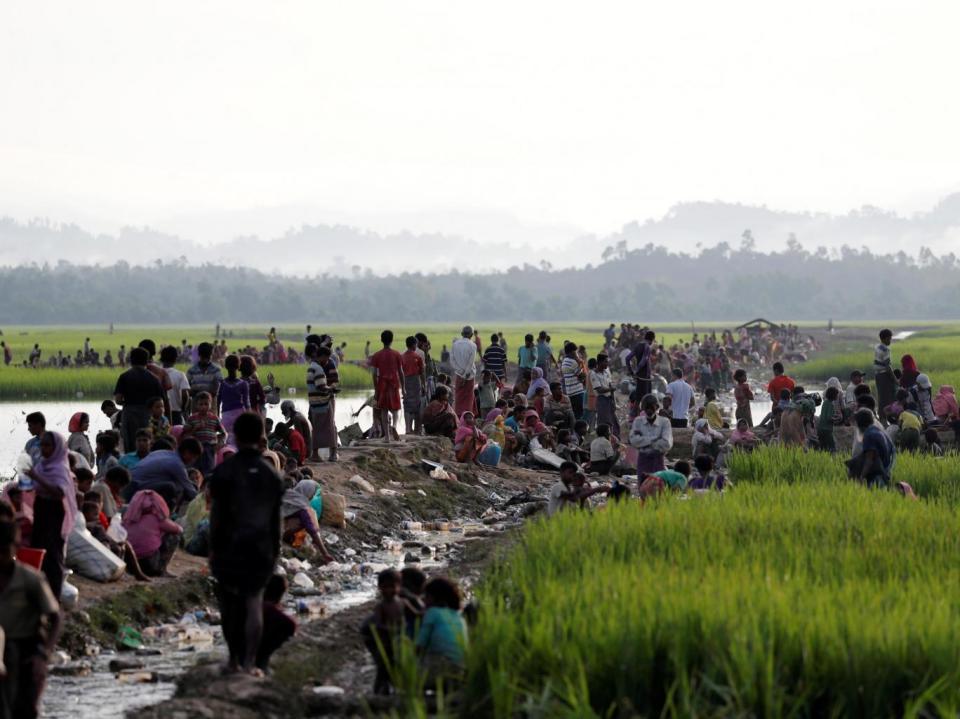 Rohingya refugees, who crossed the border from Burma a day before, wait to receive permission from the Bangladeshi army to continue their way to the refugee camps in Palang Khali (Jorge Silva/Reuters)