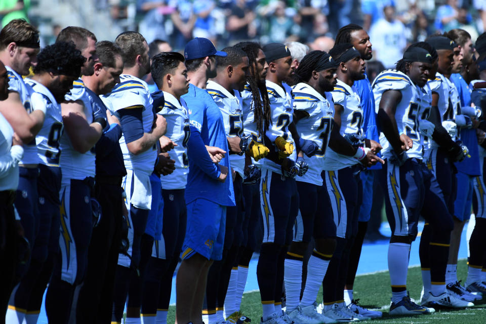 <p>The Los Angeles Chargers stand for the National Anthem prior to the game against the Philadelphia Eagles at StubHub Center. Mandatory Credit: Richard Mackson-USA TODAY Sports </p>