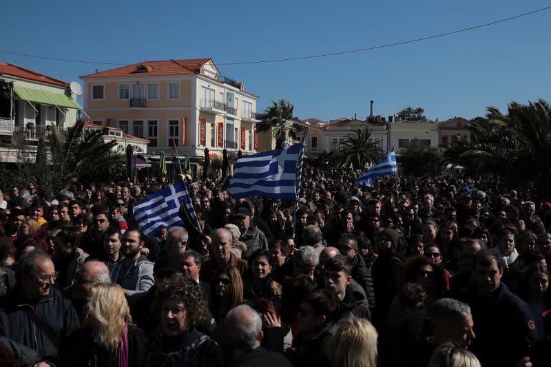 Locals, who oppose the building of a new closed migrant detention centre, take part in a demonstration in the city of Mytilene, on the island of Lesbos