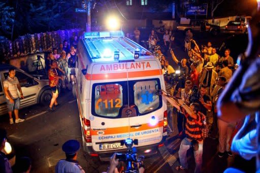 An ambulance carrying former Romanian Prime Minister Adrian Nastase speeds away in Bucharest. Nastase attempted suicide Wednesday, hours after the Supreme Court threw out his appeal against a two-year jail sentence over corruption