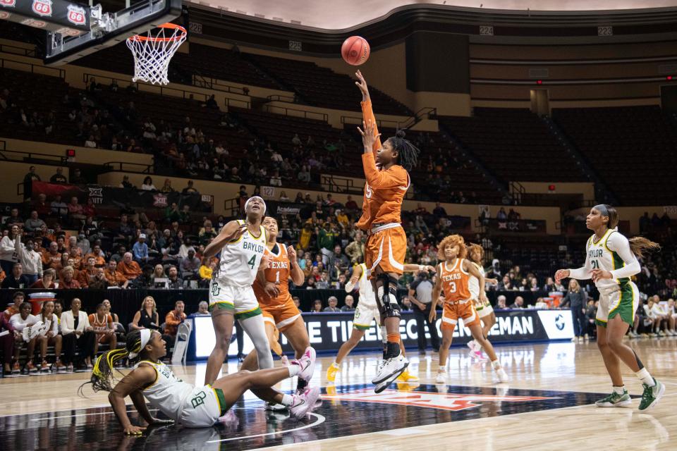 Texas forward DeYona Gaston shoots high above the Baylor defense during their Big 12 championship game matchup last season. Gaston is shooting the ball even more this season. "I want to be in the action," she said. "I want to be up there with the guards."