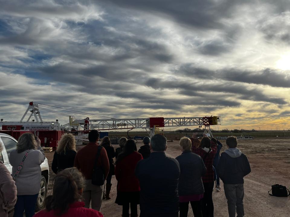 Members of the Texas Tech community gather together at the East Campus Oilfield Technology Center to watch the raising of the 140-foot mast of the first full-scale operational oil rig on a university campus in the nation.