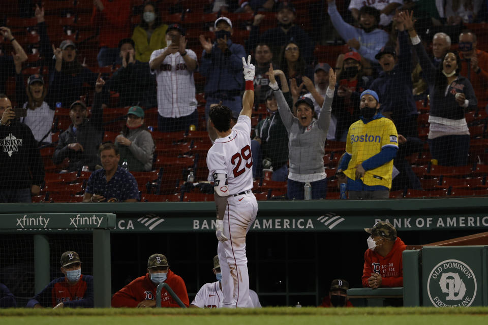 Boston Red Sox's Bobby Dalbec acknowledges the fans after his two-run home run against the Los Angeles Angels during the seventh inning of a baseball game Friday, May 14, 2021, at Fenway Park in Boston. (AP Photo/Winslow Townson)