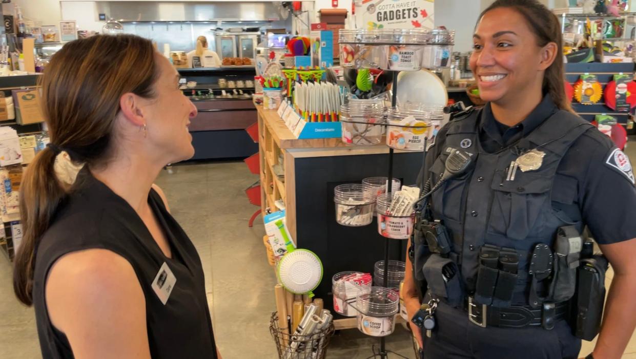 Officer Zuri Gebert speaks with a business in the Southernside, Hampton-Pinckney area.