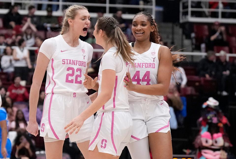Stanford's Hannah Jump, center, is congratulated by Cameron Brink, left, and Kiki Iriafen after a 3-point shot in a win over UCLA last month.