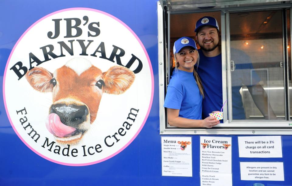 Briley and Jared Simpkins in their JB's Barnyard trailer on Thursday, May 13, 2021.