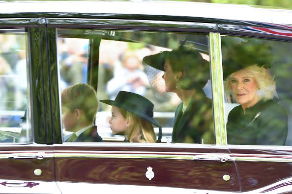 LONDON, ENGLAND - SEPTEMBER 19: Princess Charlotte of Wales, Prince George of Wales, Catherine, Princess of Wales and Camilla, Queen consort are seen on The Mall ahead of The State Funeral for Queen Elizabeth II on September 19, 2022 in London, England. Elizabeth Alexandra Mary Windsor was born in Bruton Street, Mayfair, London on 21 April 1926. She married Prince Philip in 1947 and ascended the throne of the United Kingdom and Commonwealth on 6 February 1952 after the death of her Father, King George VI. Queen Elizabeth II died at Balmoral Castle in Scotland on September 8, 2022, and is succeeded by her eldest son, King Charles III.  (Photo by Anthony Devlin/Getty Images)