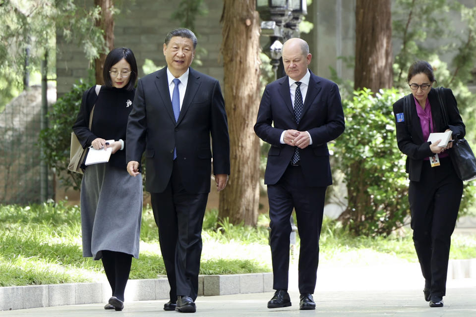 FILE - In this photo released by Xinhua News Agency, Chinese President Xi Jinping, second from left, and German Chancellor Olaf Scholz, second from right, walk together in Beijing, China, on Tuesday, April 16, 2024. Europe wants two things from China: First, a shift in its relatively pro-Russia position on the war in Ukraine. Second, a reduction in the trade imbalance. It’s not clear if it will get very far on either front. (Ding Haitao/Xinhua via AP, File)