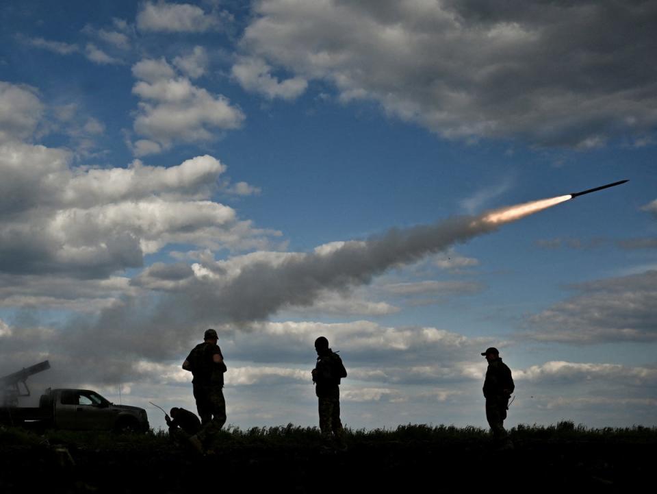 Ukrainian servicemen fire a Partyzan multiple launch rocket system towards Russian troops near a frontline in the Zaporizhzhia region (Reuters)