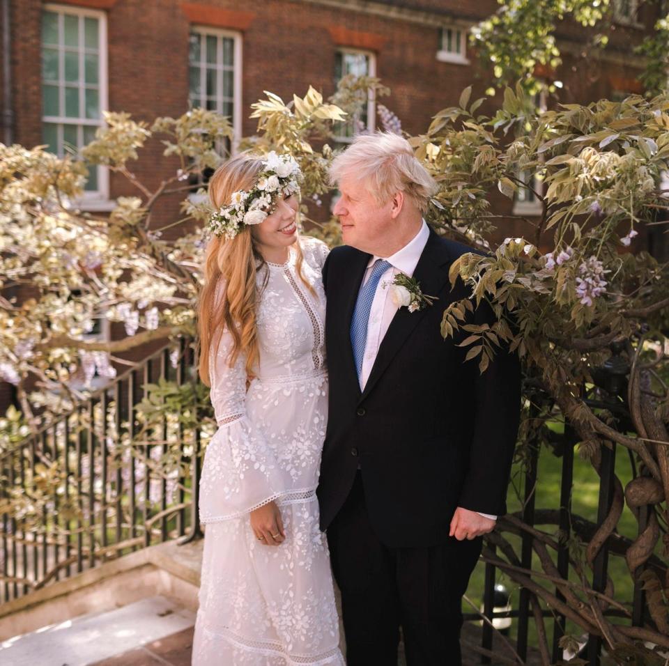 Carrie (wearing a rented dress) and Boris Johnson in the garden of 10 Downing Street following their wedding in May 2021