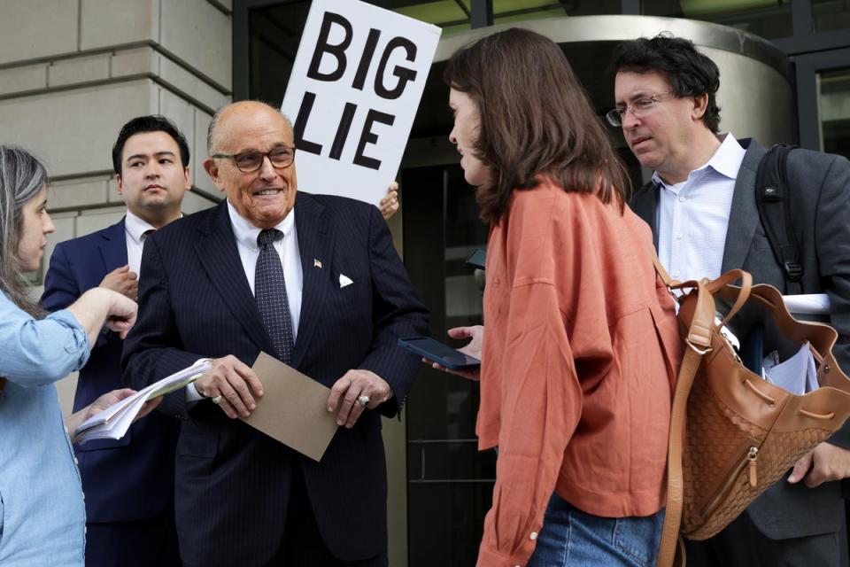 Rudy Giuliani is pictured leaving federal court in Washington DC on 19 May (Getty Images)