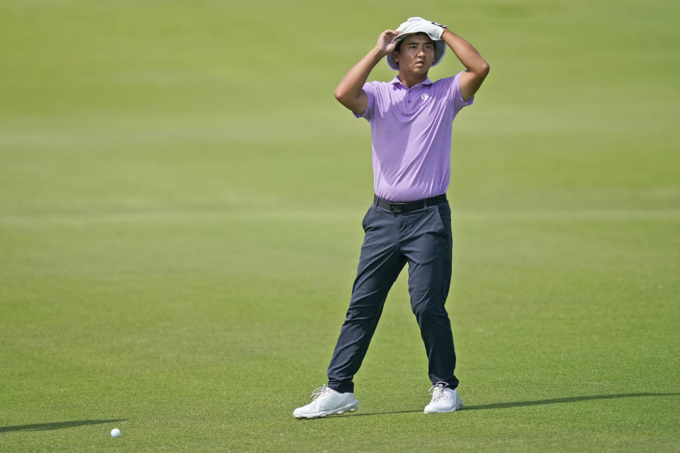 Zecheng Dou, of China, prepares to hit an approach shot on the 18th hole during the third round of the Byron Nelson golf tournament in McKinney, Texas, Saturday, May 13, 2023. (AP Photo/LM Otero)