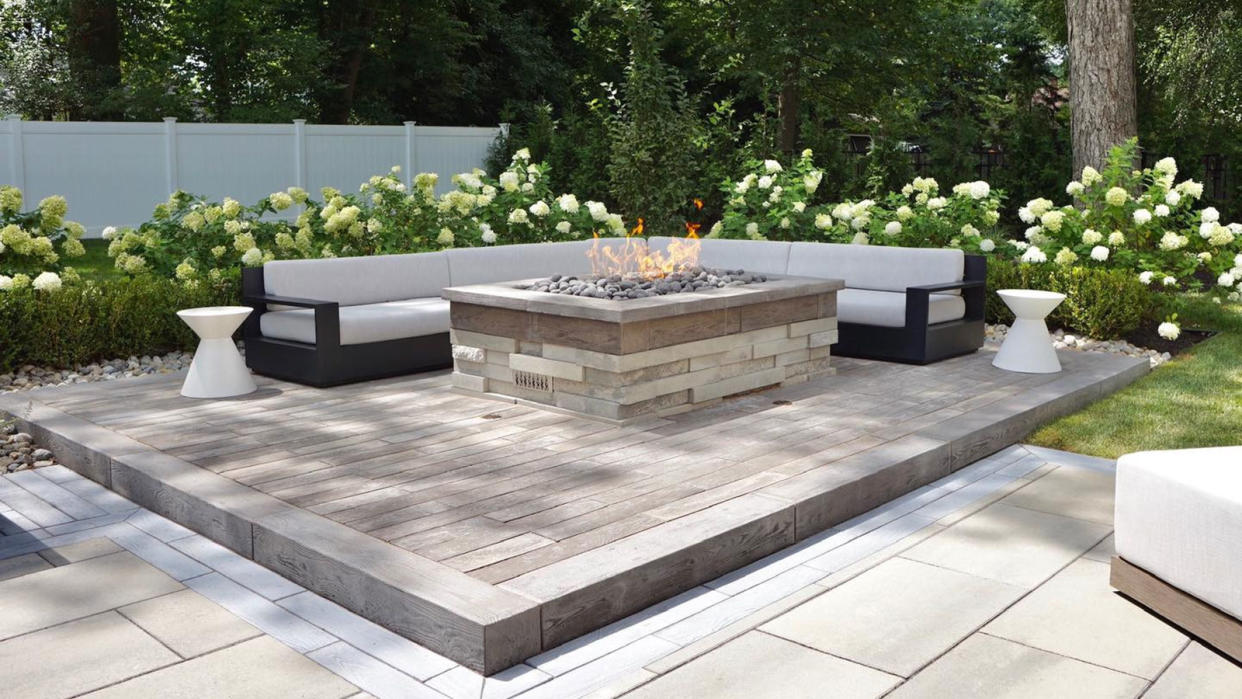  patio with central fire pit and white hydrangeas 