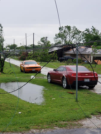 Cars and debris seen in the aftermath of a tornado in Franklin, Texas, U.S., in this image from social media dated April 13, 2019. CHUCK BATTEN/via REUTERS