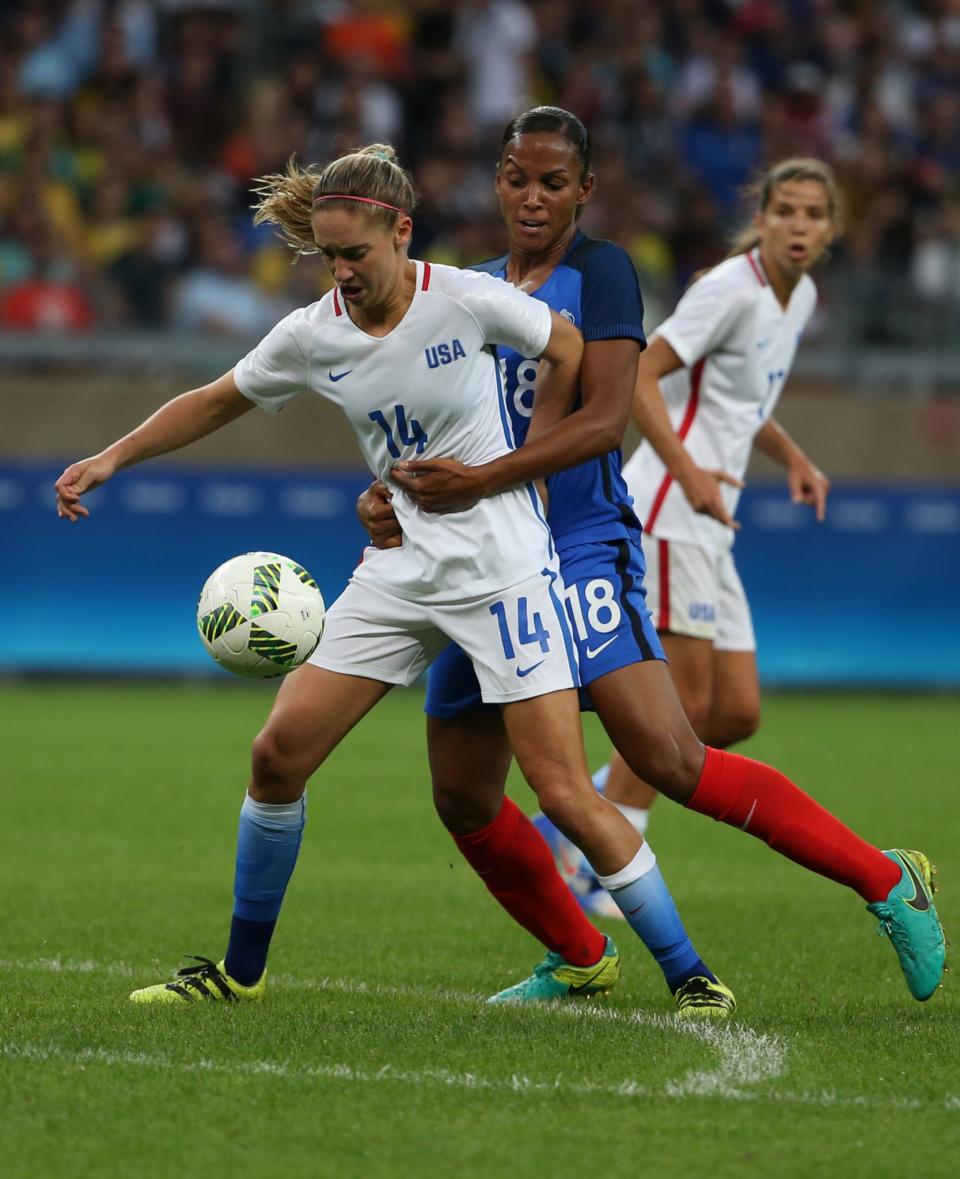 <p>United States’ Morgan Brian, left, fights for the ball with France’s Maire Laure Delie during a group G match of the women’s Olympic football tournament between United States and France at the Mineirao stadium in Belo Horizonte, Brazil, Saturday, Aug. 6, 2016. (AP Photo/Eugenio Savio) </p>