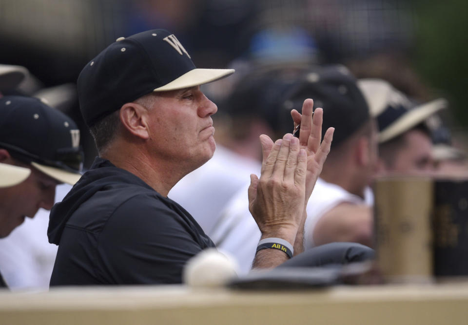 Wake Forest head coach Tom Walter encourages his Deacons in their 7-5 win over Virginia Tech in an NCAA college baseball game, Friday, May 19, 2023, at Couch Field in Winston-Salem, N.C. Baseball has often played a secondary role during his 27-year career even though he has won more than 800 games and taken three different schools to the national tournament. (Walt Unks/The Winston-Salem Journal via AP)