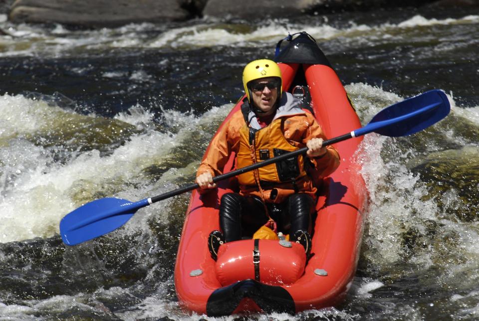 In this Aug. 24, 2013 photo provided by James Swedberg, Phil Brown rides an inflatable kayak called a ducky through the Hudson River Gorge in Minerva, N.Y. Whitewater enthusiasts can find guided ducky outings in many parts of the country, often on lesser rapids than the big rafts run. Nate Pelton's North Creek Rafting Co. was the only outfitter offering ducky trips this season through the Hudson River Gorge. (AP Photo/James Swedberg, James Swedberg)