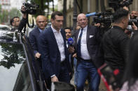 Jordan Bardella, center left, president of the far-right National Rally party, arrives at the party headquarters, Monday, July 1, 2024 in Paris. France's National Rally surged into the lead in the first round of legislative elections, according to results released early Monday, bringing the far-right party to the brink of power and dealing a major blow to President Emmanuel Macron's centrists in an election that could set the country, and Europe, on a starkly different course. (AP Photo/Thibault Camus)