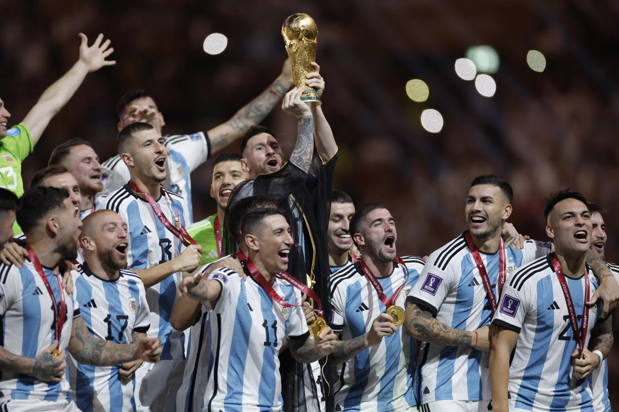 Lionel Messi of Argentina lifts the FIFA World Cup trophy at the presentation ceremony during the FIFA World Cup 2022 Final between Argentina and France at Lusail Iconic Stadium on December 18th 2022 in Doha, Qatar (Photo by Tom Jenkins/Getty Images)