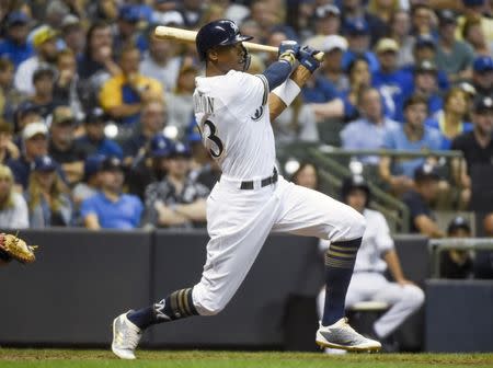 Jul 21, 2018; Milwaukee, WI, USA; Milwaukee Brewers right fielder Keon Broxton (23) hits a triple to drive in a run in the sixth inning against the Los Angeles Dodgers at Miller Park. Mandatory Credit: Benny Sieu-USA TODAY Sports