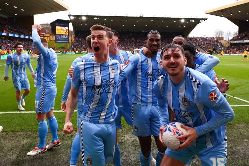 Haji Wright of Coventry City celebrates scoring the winning goal with Ben Sheaf and Liam Kitching at Molineux on March 16, 2024 in Wolverhampton