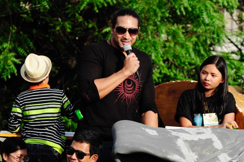 Eric Tai is seen at the float of the MMFF 2012 entry, "Shake Rattle and Roll 14: The Invasion" during the 2012 Metro Manila Film Festival Parade of Stars starting on 23 December 2012. (Angela Galia/NPPA Images)