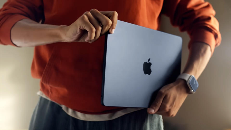 The MacBook Air M2 being carried while closed