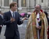 Britain's Prince Harry, left, walks with John Hall, Dean of Westminster Abbey to attend the Nelson Mandela memorial service at the Abbey in London Monday, March 3, 2014. Mandela the former president of South Africa died in December 2013. (AP Photo/Alastair Grant)