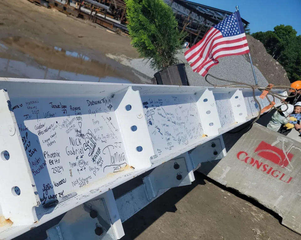 The ceremonial last beam of the new Bristol-Plymouth Regional Technical School building in Taunton, signed by members of the community, waits to be hoisted into place on Friday, May 31, 2024.