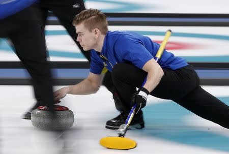 Curling - Pyeongchang 2018 Winter Olympics - Men's Final - Sweden v U.S. - Gangneung Curling Center - Gangneung, South Korea - February 24, 2018 - Lead Christoffer Sundgren of Sweden delivers the stone. REUTERS/John Sibley